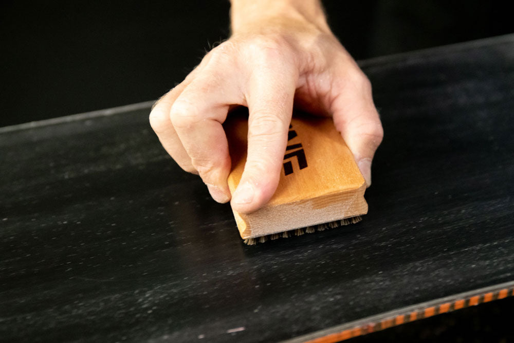 How to brush your wax on a snowboard or skis