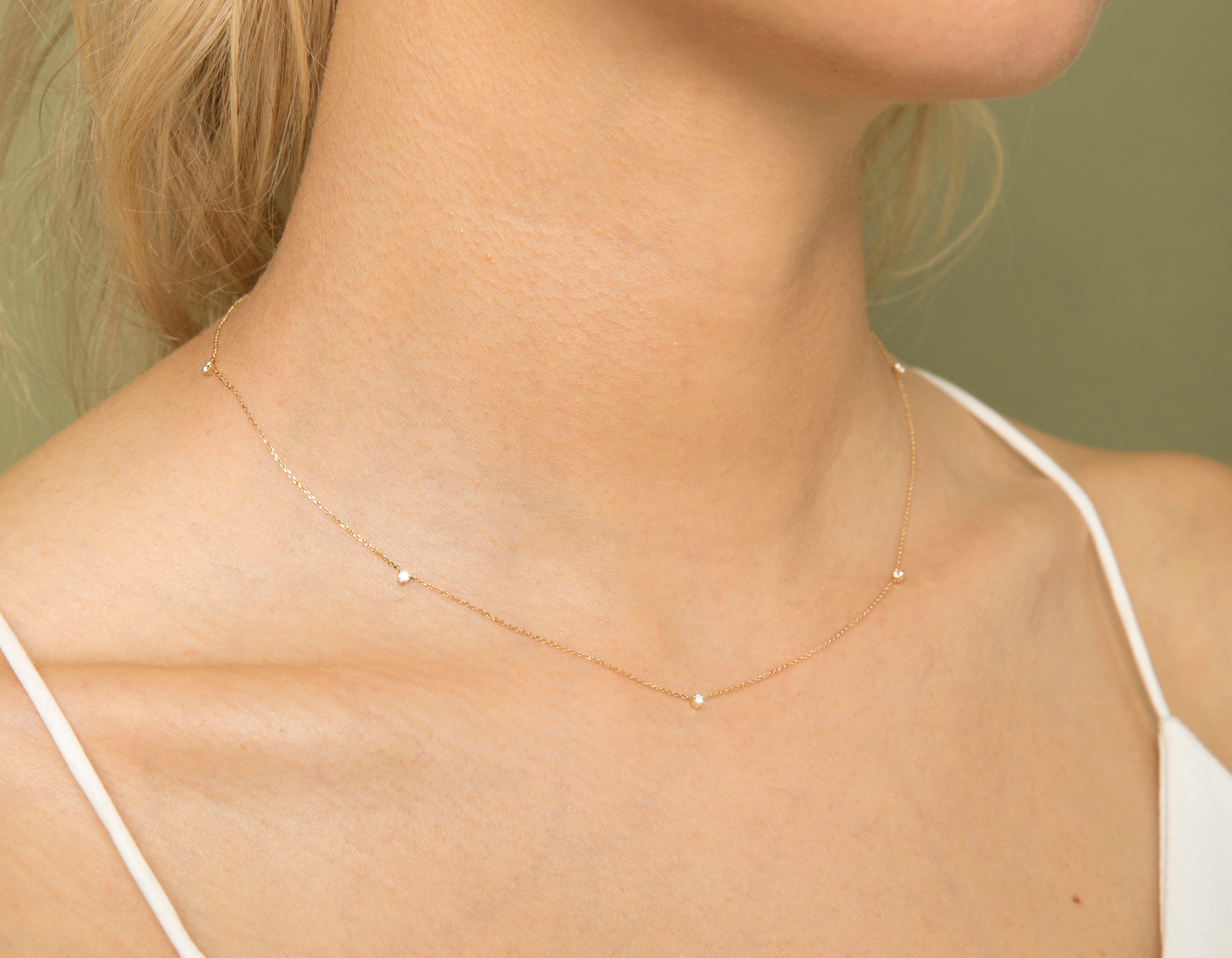 thin necklace with small diamond