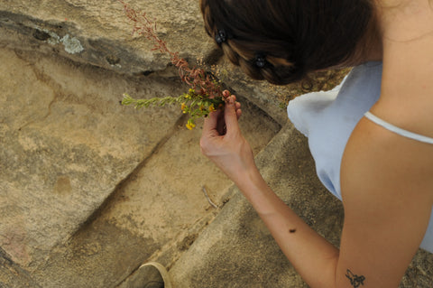 Ellie, founder of Ella Roe Jewelry, foraging 