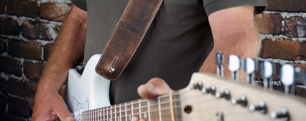 How To Put On a Guitar Strap