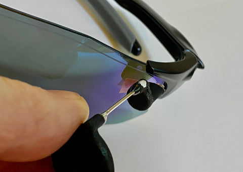 Test fit the bike mirror to your glasses lens