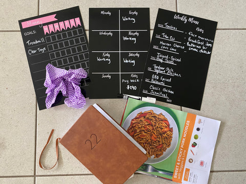 Magnetic planners laid out with diary and recipe card