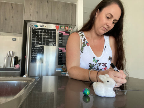 Woman is writing on her fridge planner