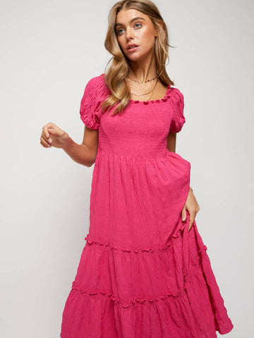 Davi Model in size small fuschia dress.