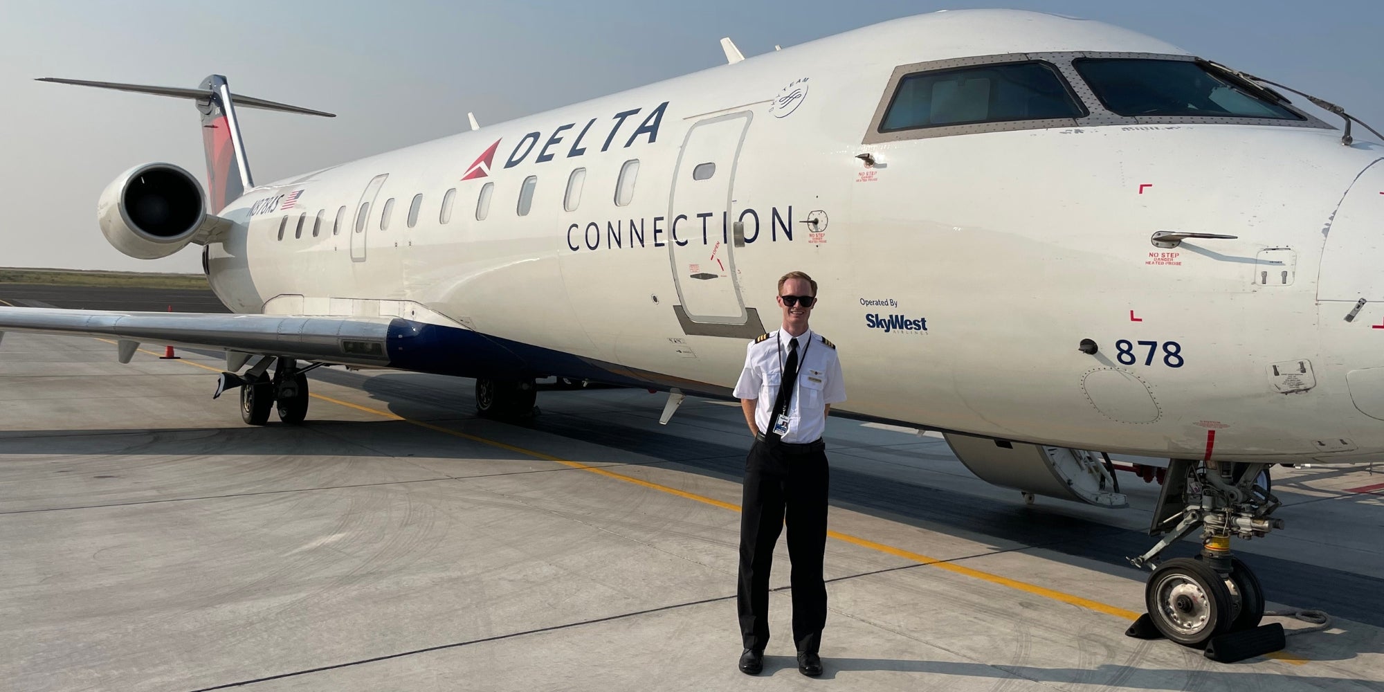 Dallan in front of Delta plane 