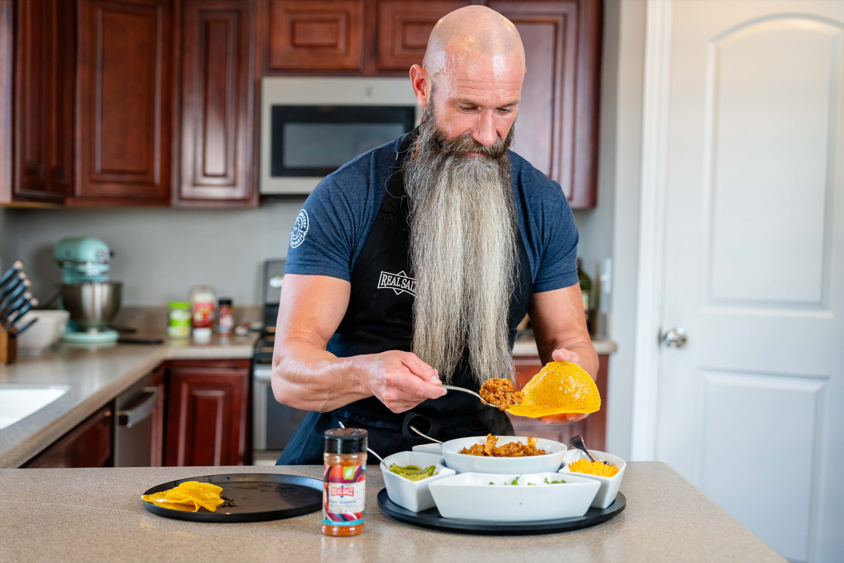 Ben adding ingredients to his tortilla