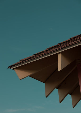 a roof with a blue sky in the background