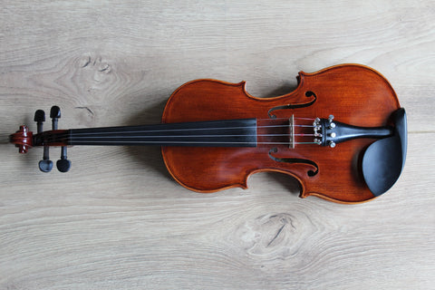 beautiful violin on a wooden table 