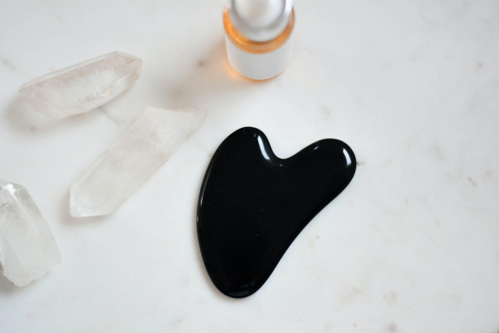 black gua sha, facial massage tool