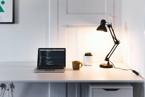 a workplace with a table lamp
