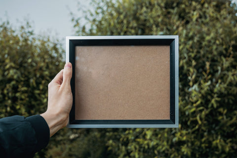 metal picture frame in hand