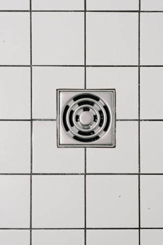 stainless steel cover of drain in modern shower