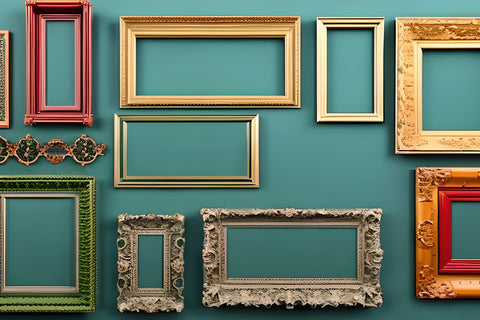 various picture frames on green wall