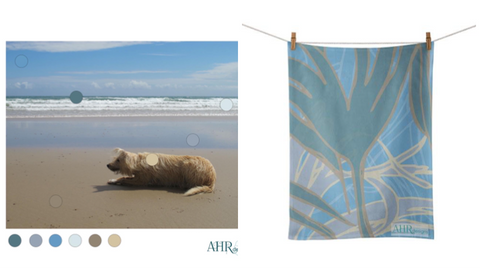 Lurcher on beach. Coastal colour palette. ‘Kelp’ tea towel designed by Anne Harrington Rees