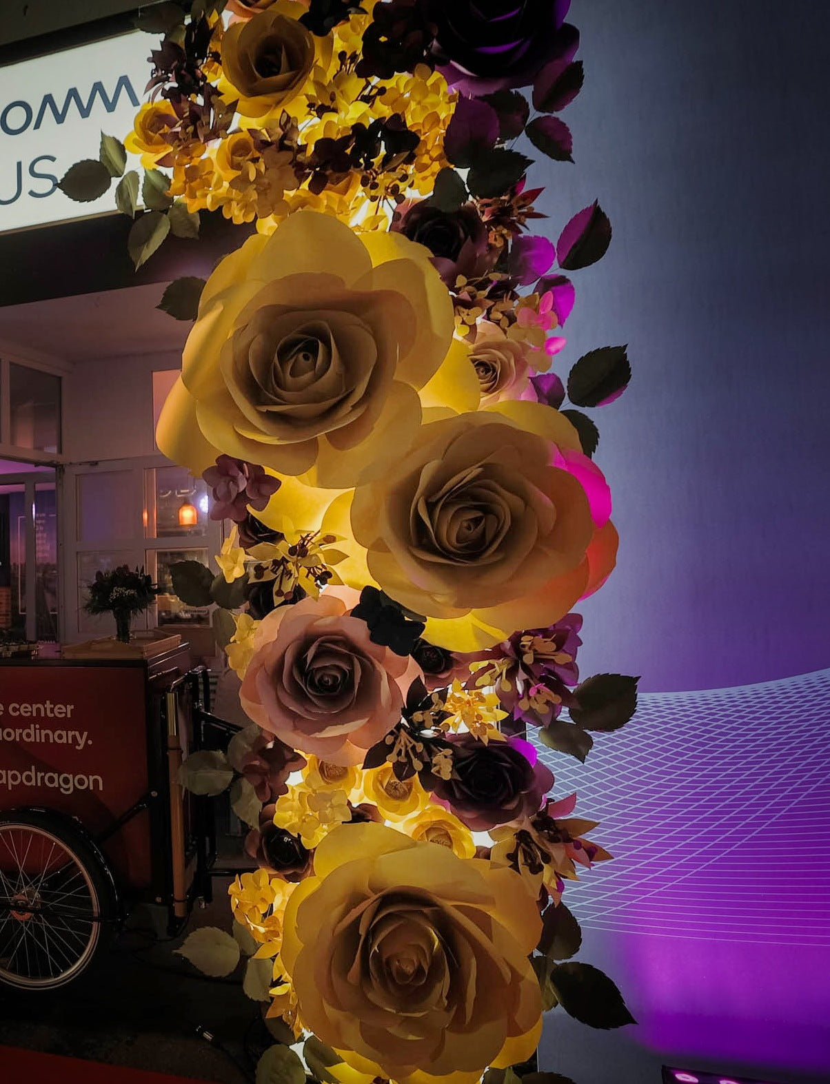 Elegantly decorated Qualcomm House with large paper roses and a welcoming flower arch during World Economic Forum in Davos 2022