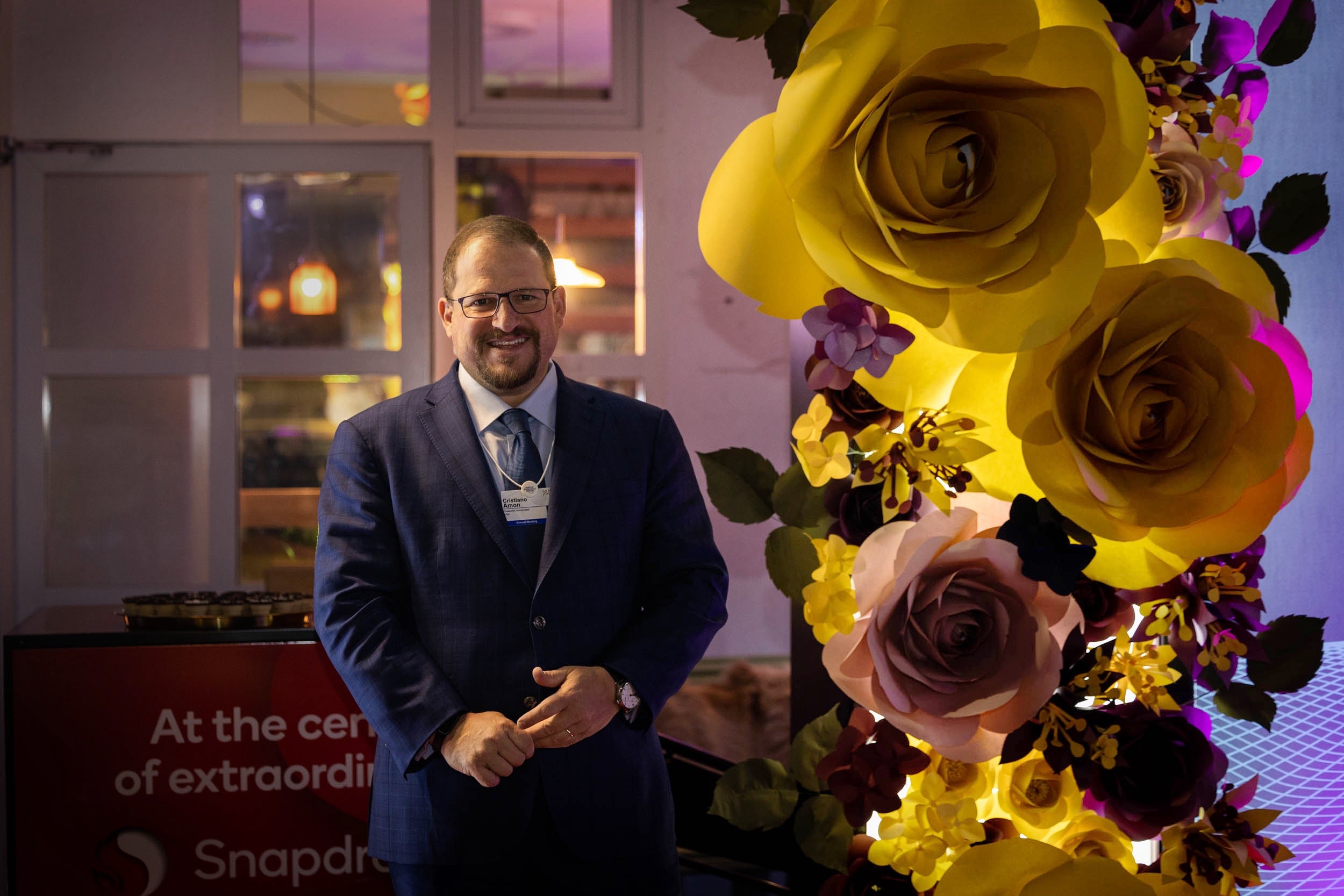 CEO Cristiano Amon posing with elegant paper roses in Qualcomm House during World Economic Forum in Davos 2022