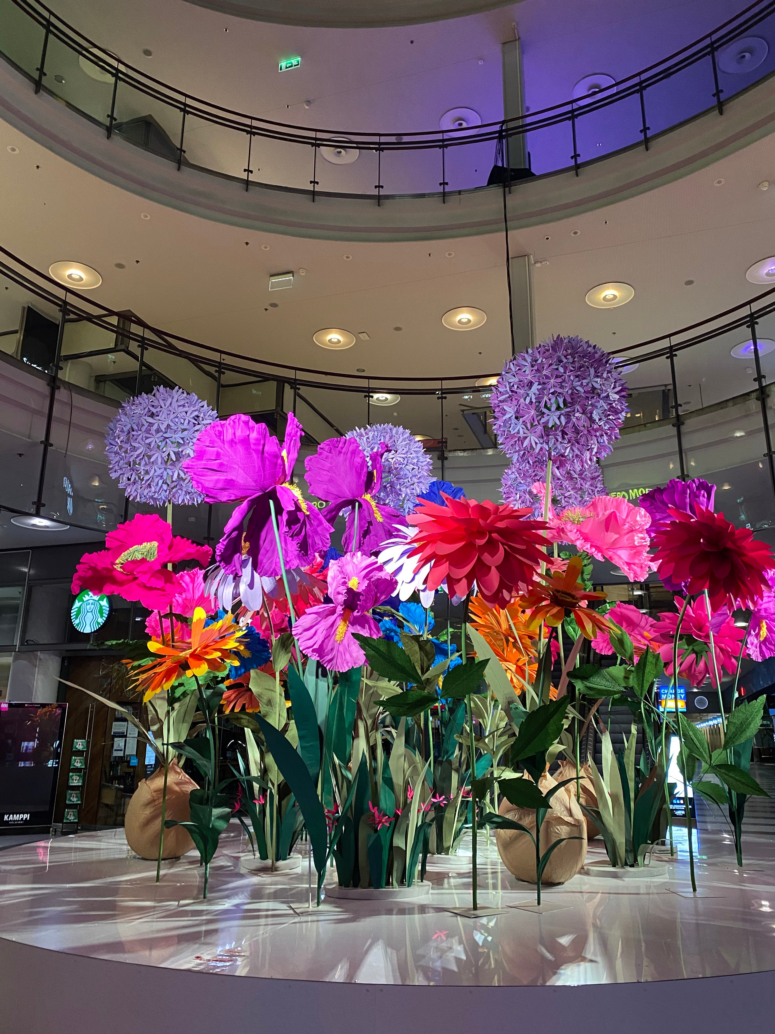 A captivating display of paper flowers in Helsinki, Finland. These intricately crafted blooms in vibrant colors add a touch of whimsy and beauty to the cityscape, showcasing the artistry and creativity of local artisans. The paper flowers create a visual feast, enchanting both residents and visitors with their stunning presence.