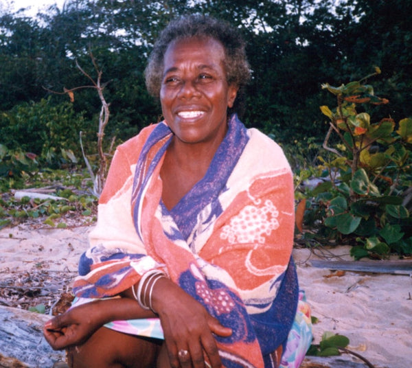 Teju's Jamaican Grandmother with a big smile and a beautiful fabric wrap.