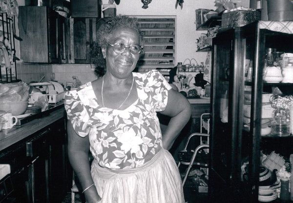 Teju's Jamaican Grandmother posing in her kitchen. 