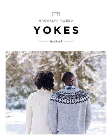 A woman and man model hand knit wool pullovers, one with a cabled yoke and one with a colorwork yoke, respectively. Title reads "Brooklyn Tweed Yokes Lookbook"