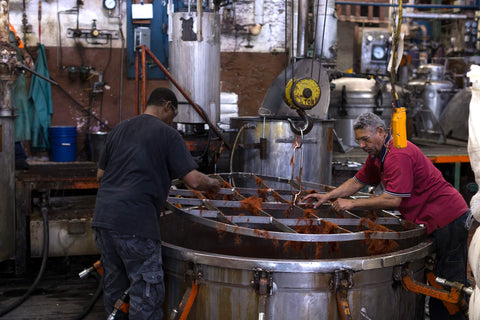 Employees at Littlewood dye house working on a dye bath