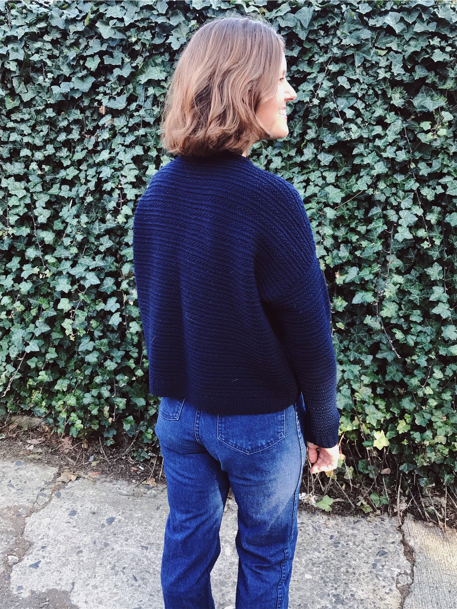 lis wears her hand knit wool weidlinger pullover sweater