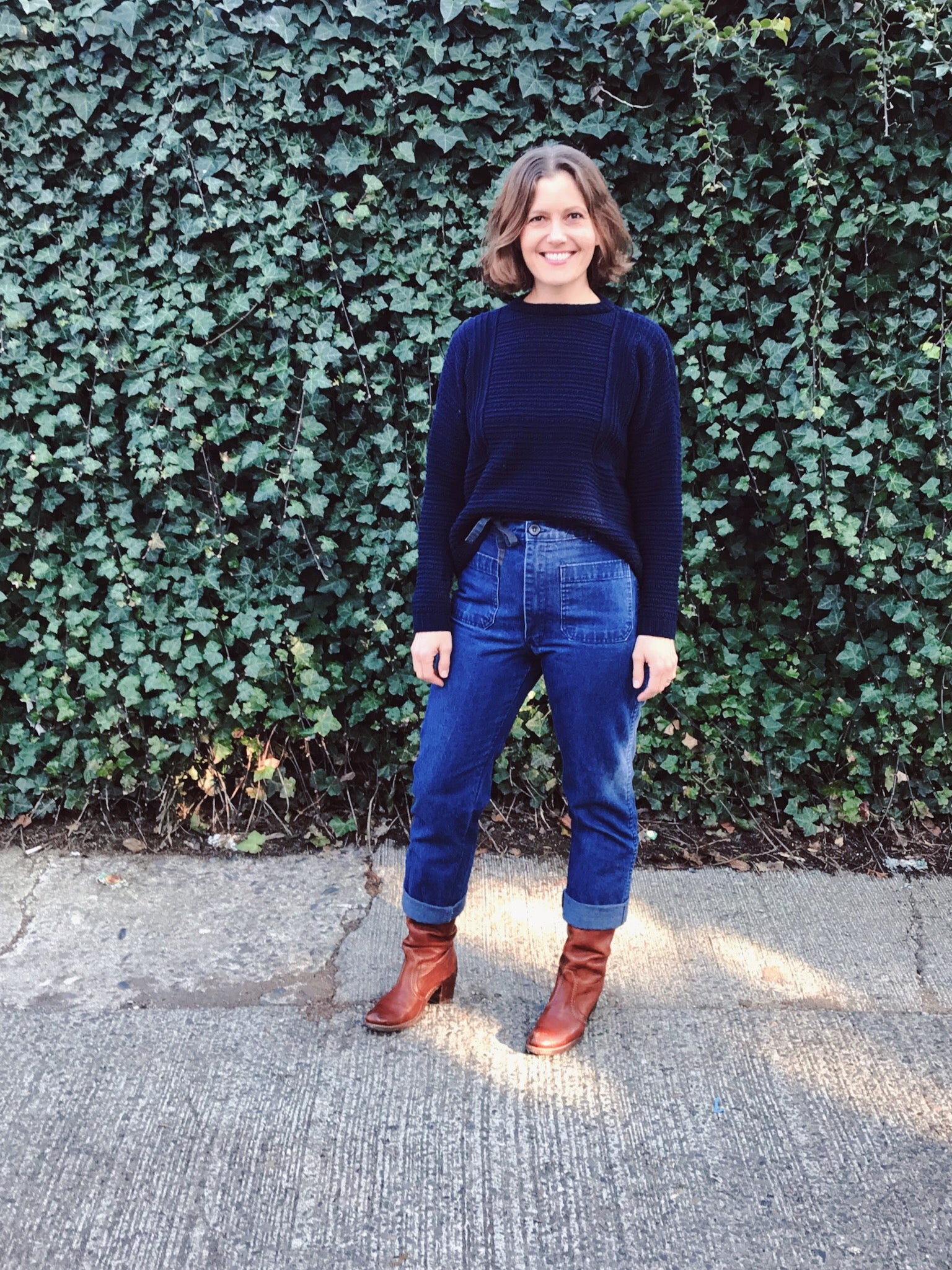 lis wearing her top down pull over weidlinger hand knit sweater