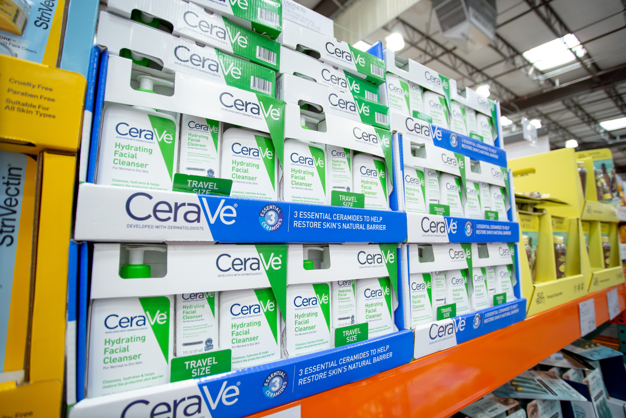 A shelf in a big-box club store displays rows of a CeraVe hydrating facial cleanser in a post on CeraVe for acne.