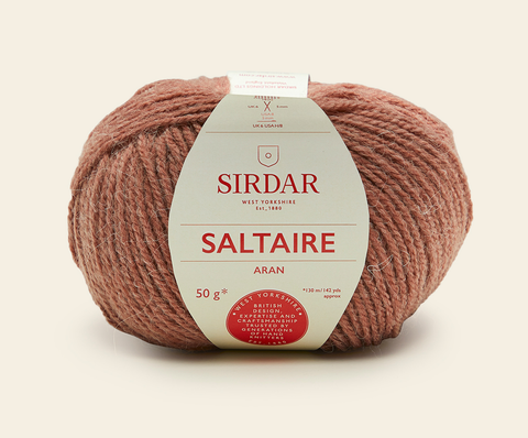 A ball of Saltaire Aran yarn in the colourway Squirrel - a dusty pink/brown