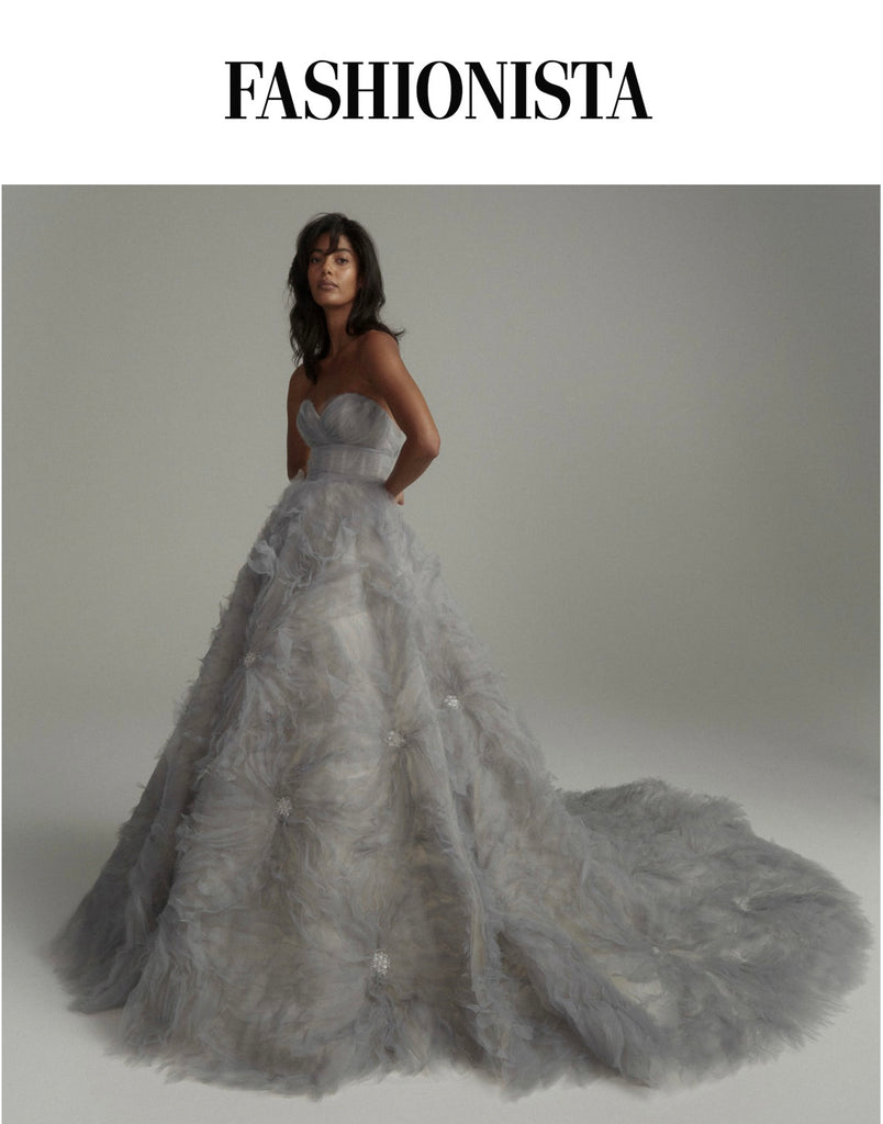 woman standing in grey tulle ballgown