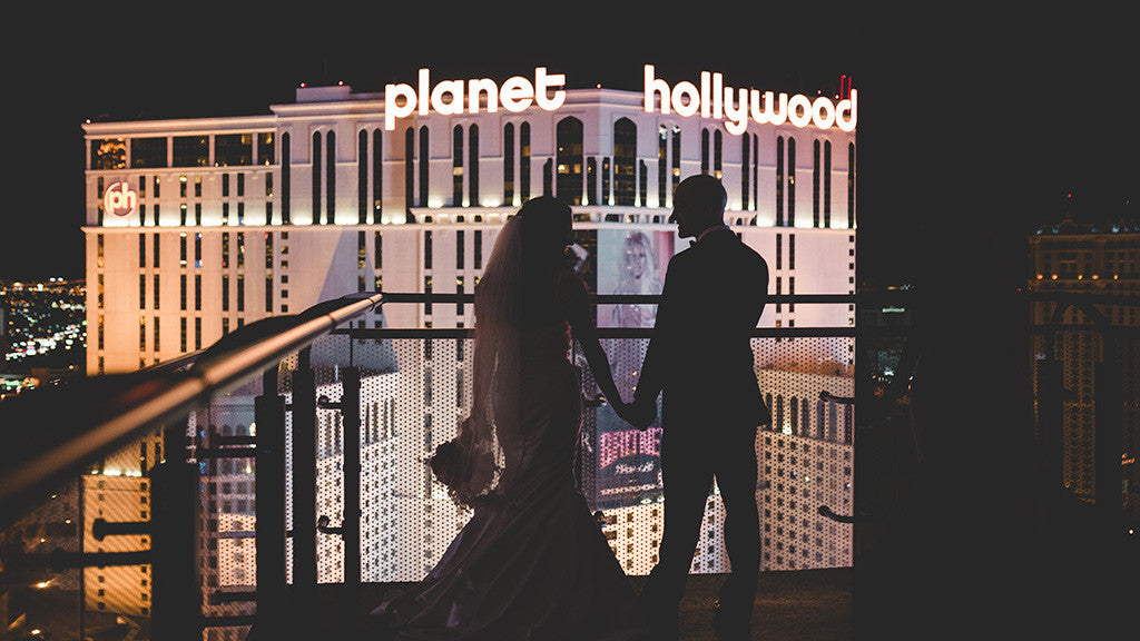 Wedding couple at the on the balcony at the Cosmopolitan Hotel in Las Vegas.