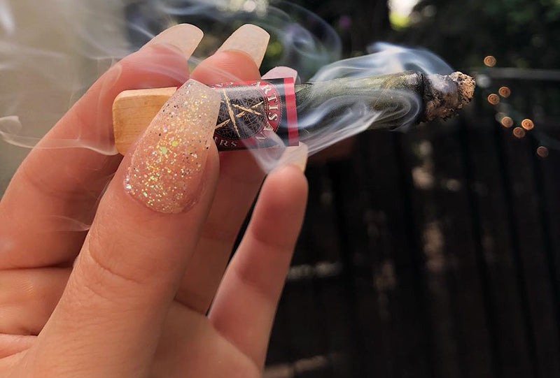 Smoking a premium weed cigar, image from Smoke Stuff on Instagram