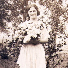 Black and white pic of Grace with flowers