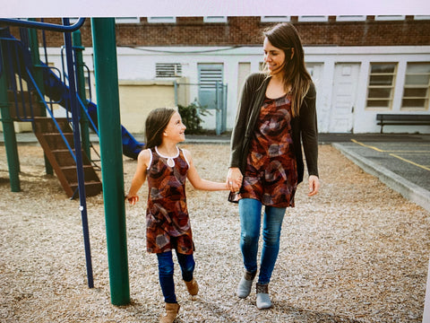 Mother and daughter models in matching dresses