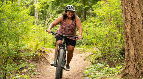 Woman on mountain biking trail