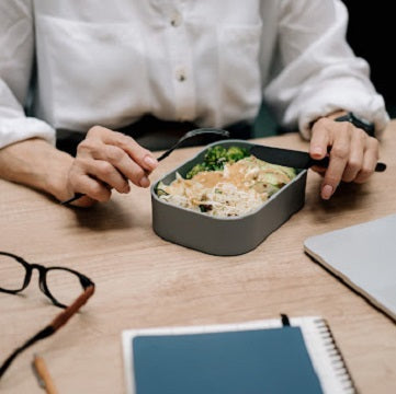 woman with lunch box at the office