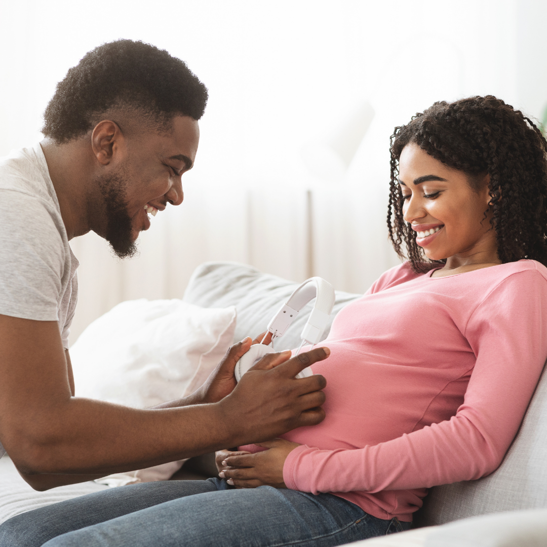 parents singing to baby in belly