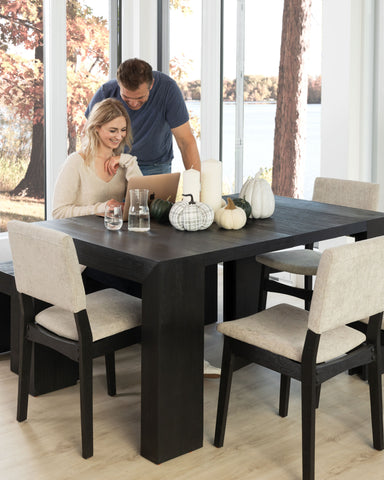 Couple sitting at a Dark Canadian Oak table