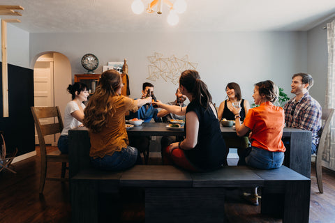 A family sitting at a dining table set