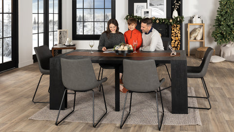 Couple sitting at a Dark Canadian Oak dining table