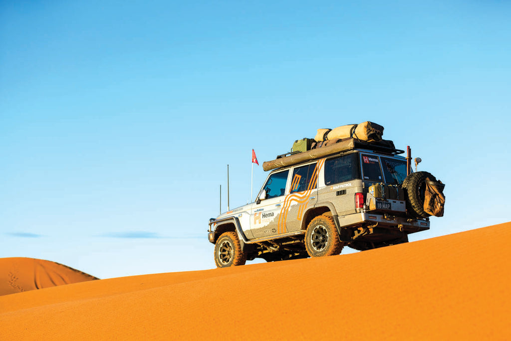 The Hema Map Patrol driving on the dunes in the desert. Credit: Matt Williams
