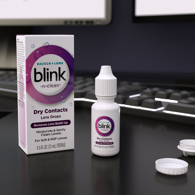Blink-N-Clean® lens drops bottle and package on a desk infront of a keyboard 