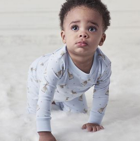 Baby wearing a Kissy Kissy romper