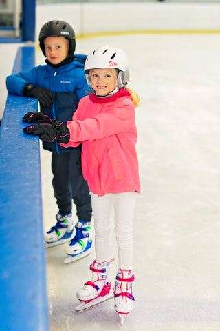 Boy and girl on adjustable ice skates - Xino Sports