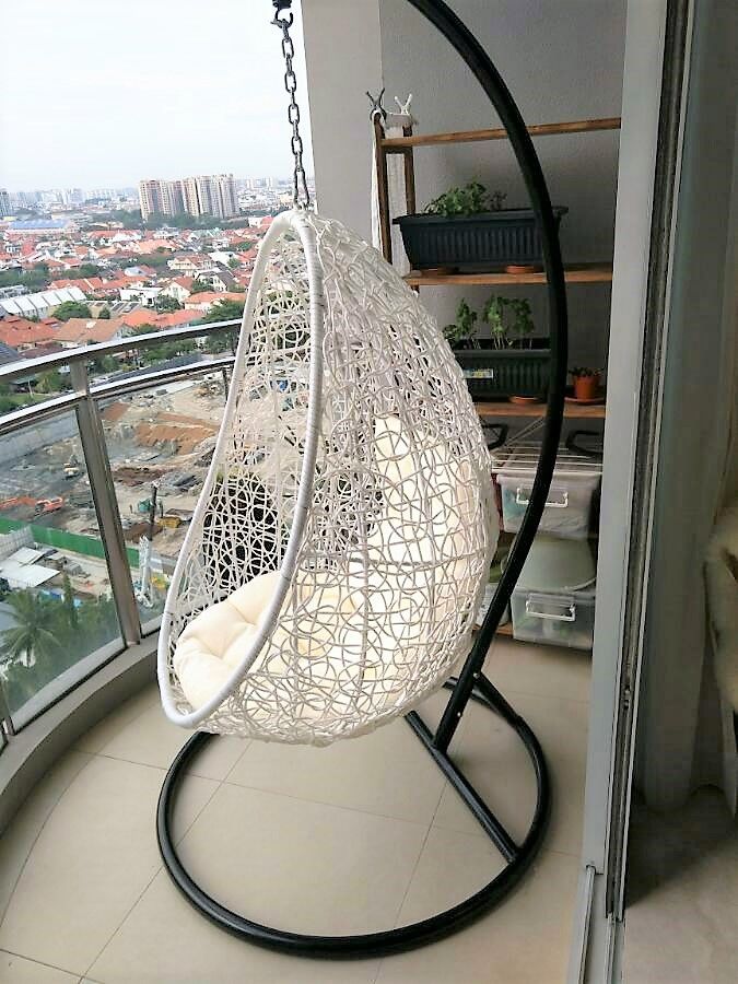 A White Swing Chair Balcony of Singapore Condo