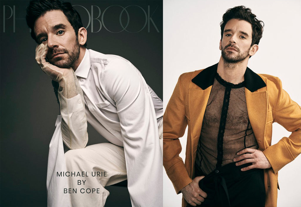 Actor Michael Urie wearing white long-sleeve shirt and yellow coat by ORTTU