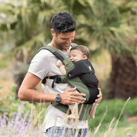 Dad wearing a Green LILLEbaby Baby Carrier with Baby