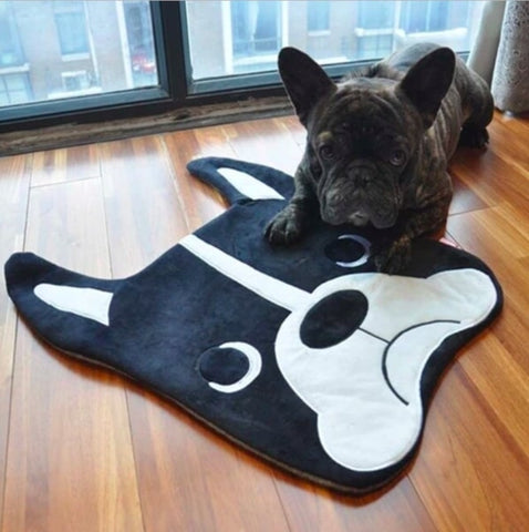 Image of a French Bulldog on top of a Boston Terrier themed rug