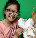 Girls with heart sewn at workshop