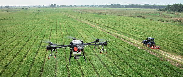 Drone spraying farmer's field